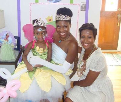 Princess Tiana with a young birthday girl and her mom